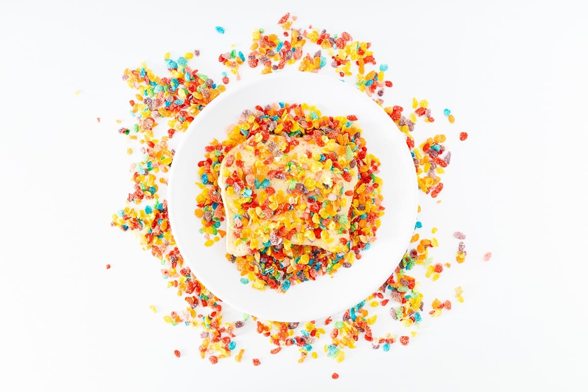 Coating toast with Fruity Pebbles