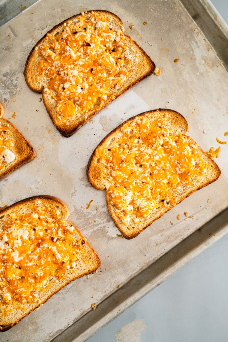 Assembling chili cheese toast