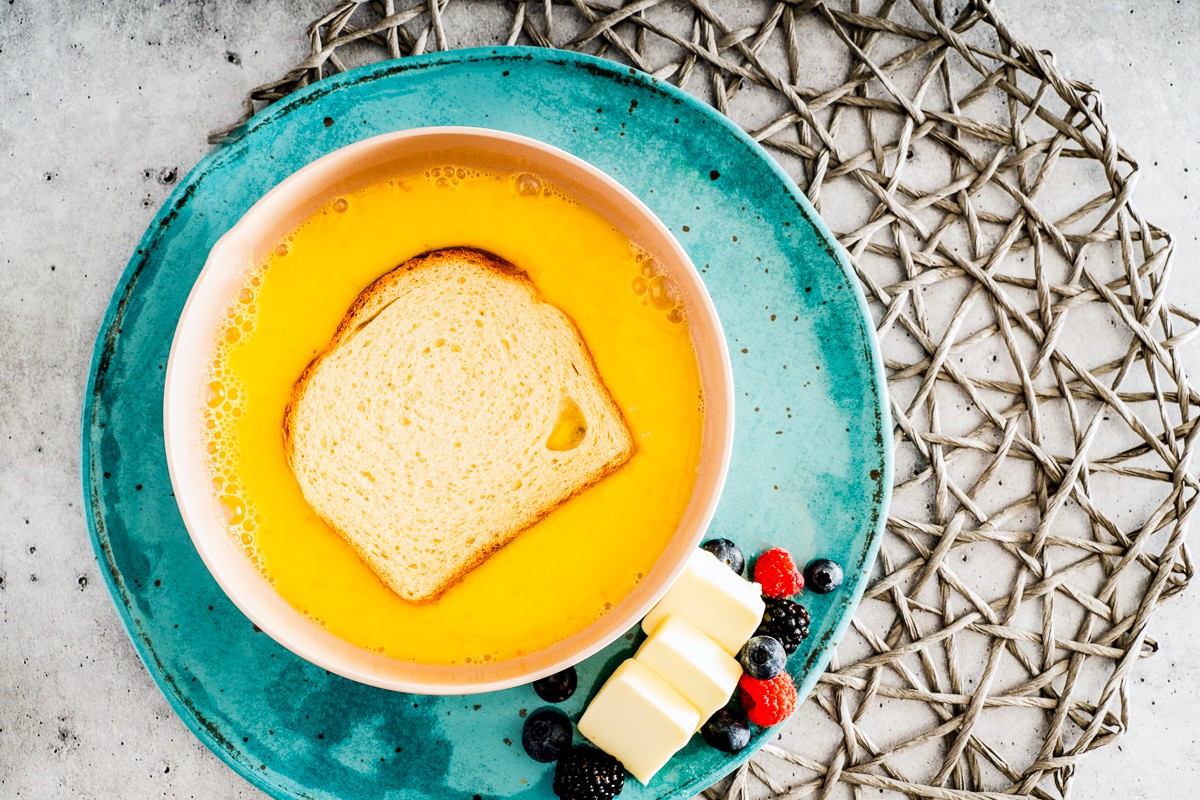 Dipping bread into a bowl