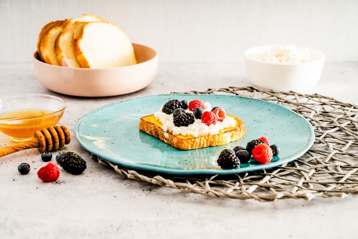 Adding fruits on top of the toast