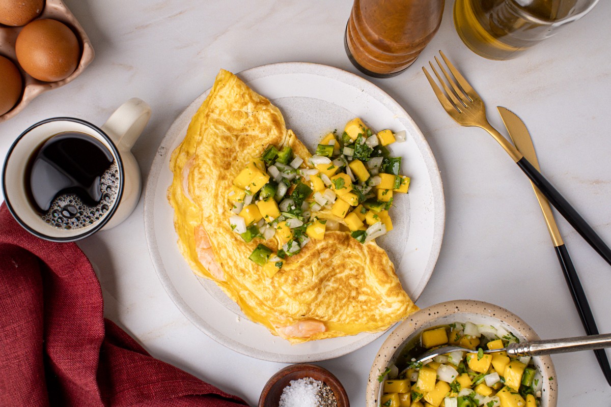 https://goldentruffle.com/wp-content/uploads/2022/06/seasoning-for-scrambled-eggs-shrimp-omelette-mango-salsa.jpg