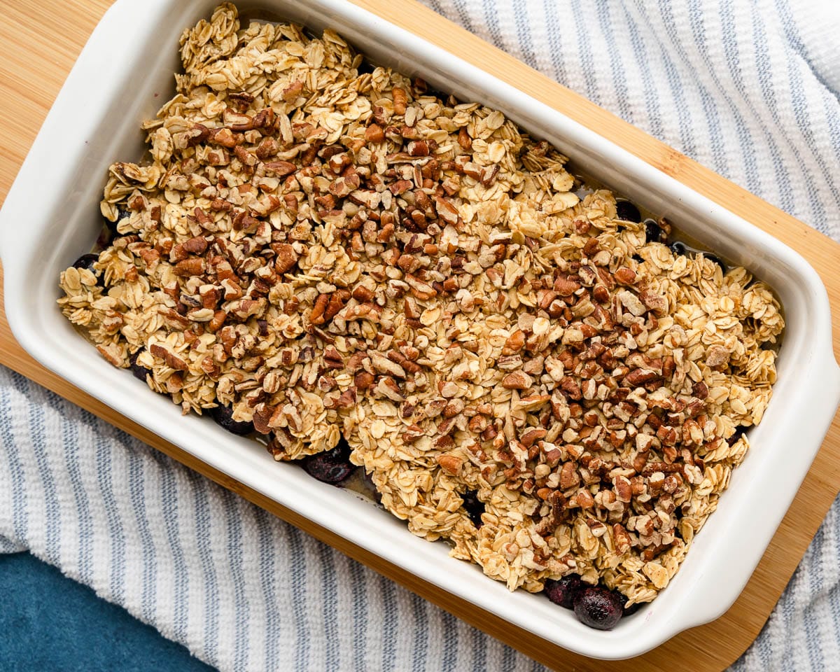 sprinkling toasted nuts on the blueberry baked oatmeal