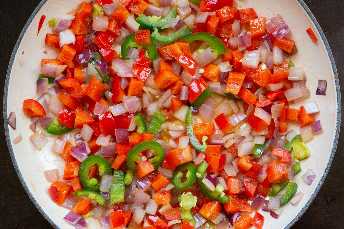 vegetables for Mexican breakfast hash sautéed in a skillet