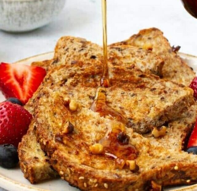 egg white french toast poured with maple syrup
