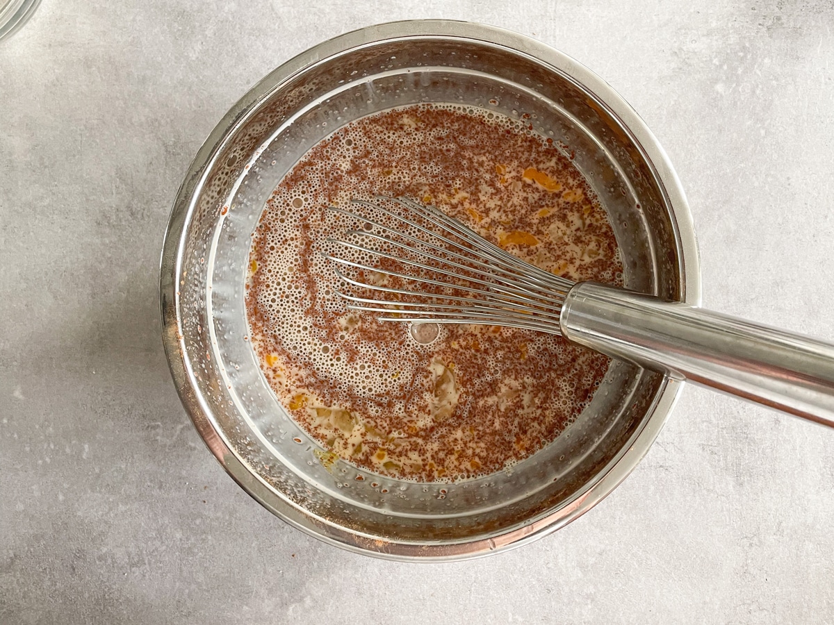 whisking ingredients to make brioche French toast casserole