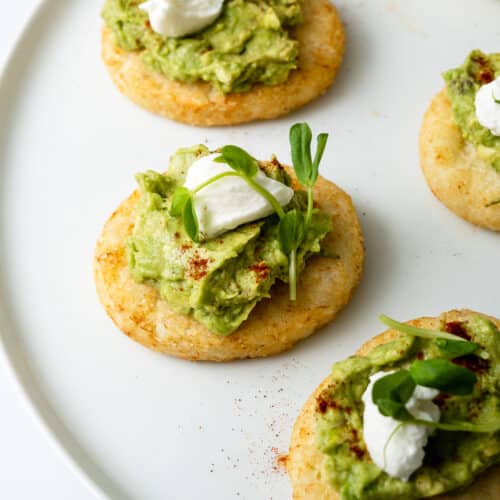 hashbrown avocado toast served on a plate