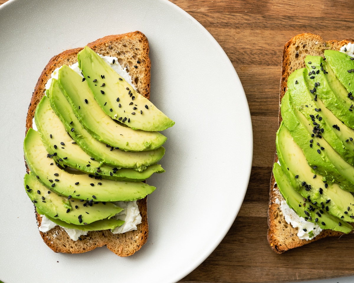 avocado cream cheese toast served on a plate